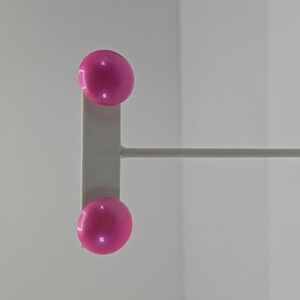 Small pink toned round earrings